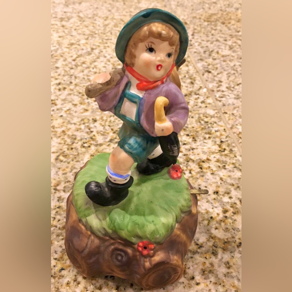 Porcelain Boy Figurine with Umbrella and Green Base